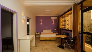 Junior Suite, City View | Desk, blackout curtains, iron/ironing board, bed sheets
