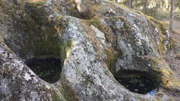 A natural rock formation with two openings.