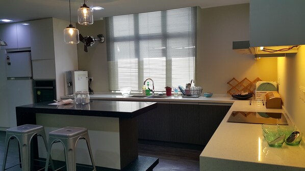 Fridge, stovetop, electric kettle, cookware/dishes/utensils - designer cozy spacious living hall and kitchen apartment (Klang Sentral)