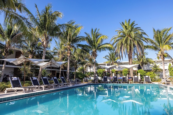 Outdoor pool, open 8:00 AM to 8:00 PM, free cabanas, pool umbrellas
