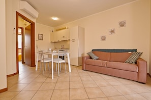 Apartment, 2 Bedrooms | Living room | Flat-screen TV