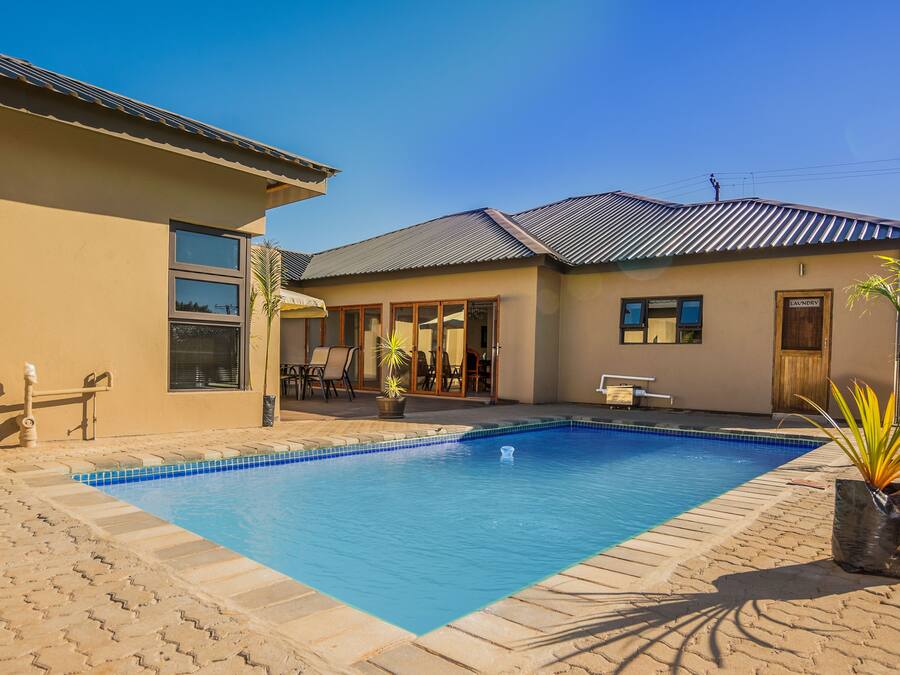 Outdoor pool, pool umbrellas, sun loungers