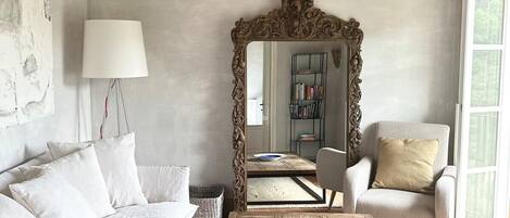 Villa | Living area | 30-inch TV with digital channels, fireplace, books