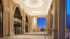 A spacious lobby with a high ceiling, large arched windows, and a central circular design on the floor. - Sheraton Yinchuan (Yinchuan)