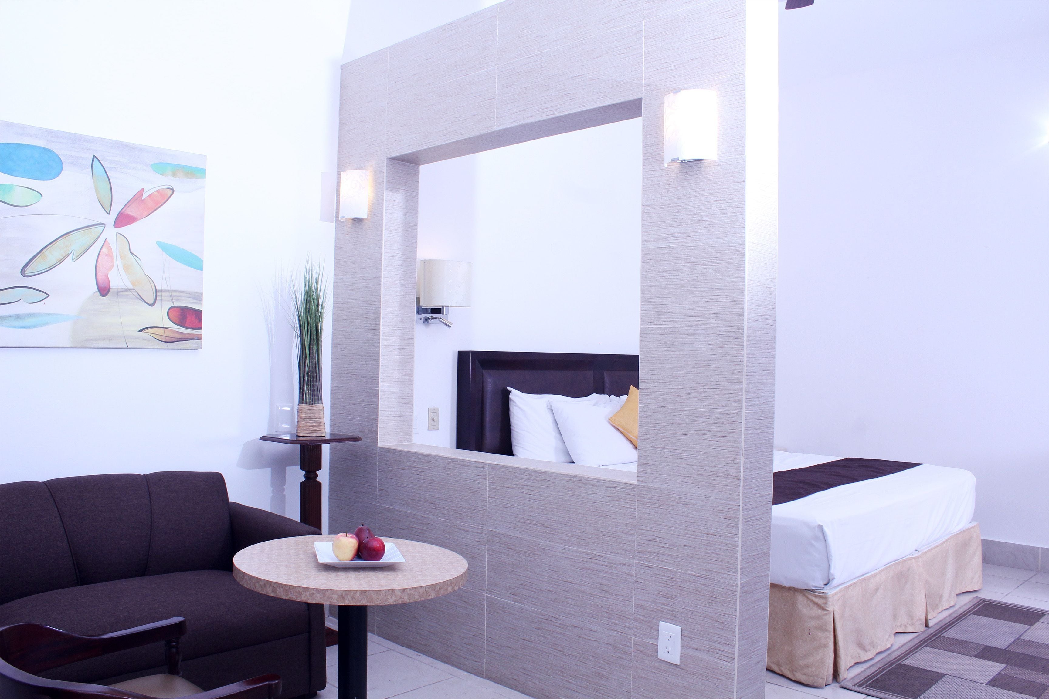 junior room, 1 king bed, courtyard view | in-room safe, individually decorated, individually furnished, desk