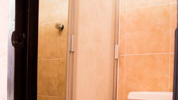 Shower, towels, soap, toilet paper