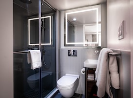 Shower, rainfall showerhead, hair dryer, towels