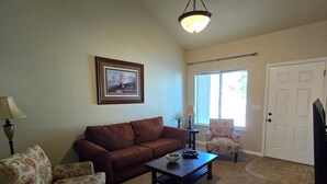 A living room with a brown sofa, patterned armchairs, a coffee table, and a framed picture on the wall. - Close to Tamarack and Cascade Lake boat ramps (Donnelly)