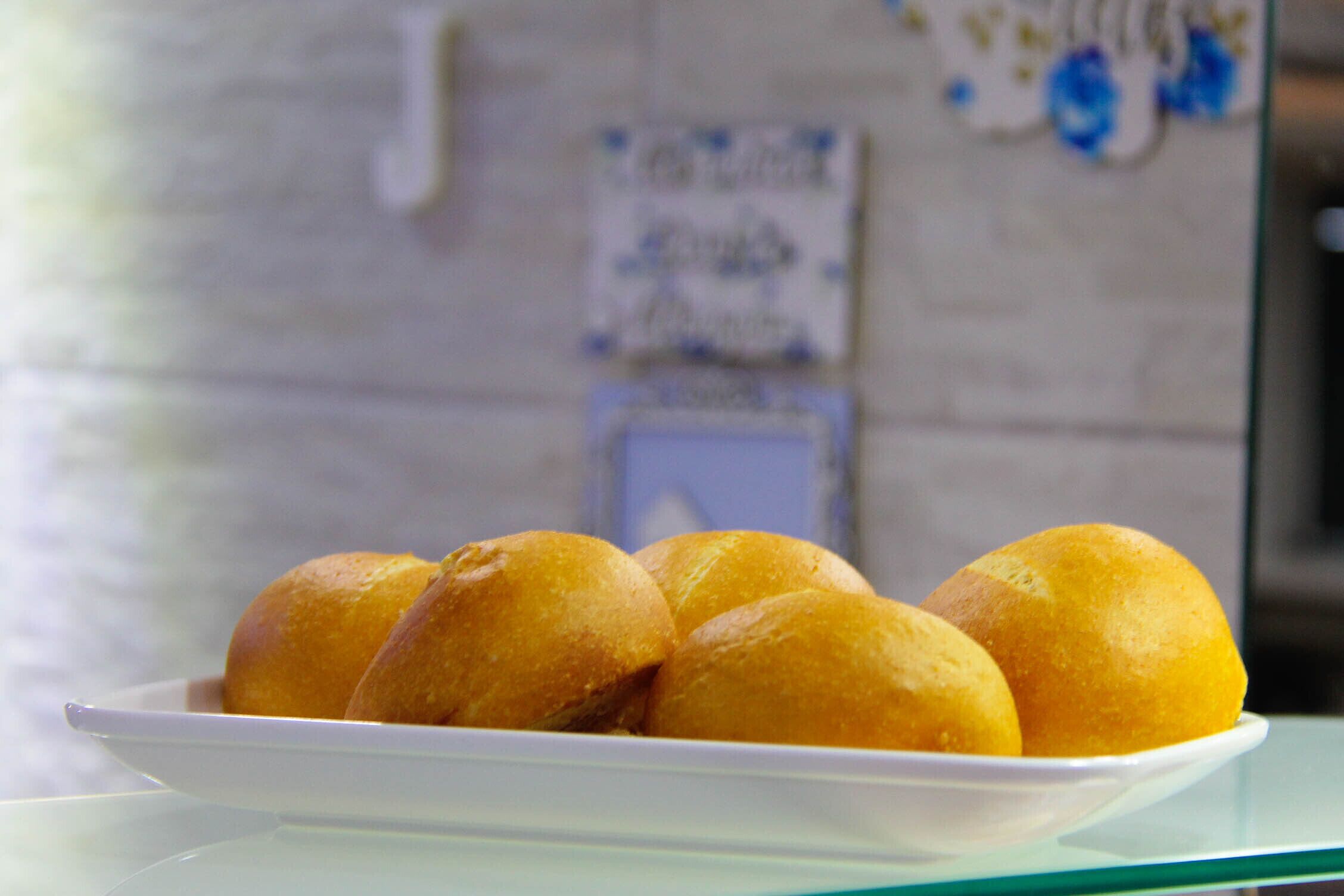 A plate of golden-brown pastries on a white plate.