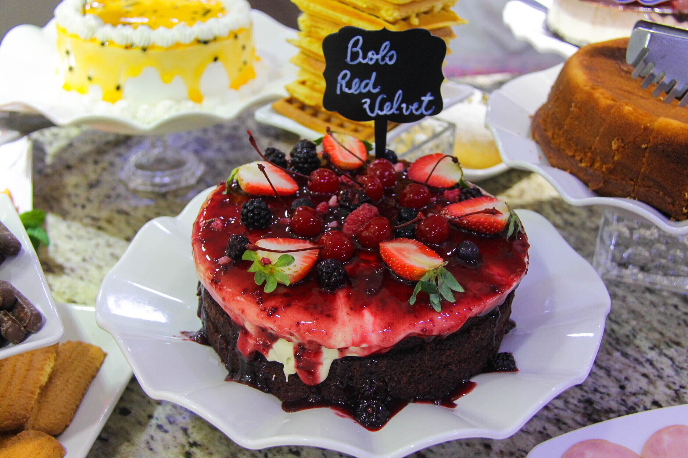 A dessert display with a variety of cakes and pastries.