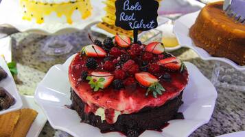 A dessert display with a variety of cakes and pastries.