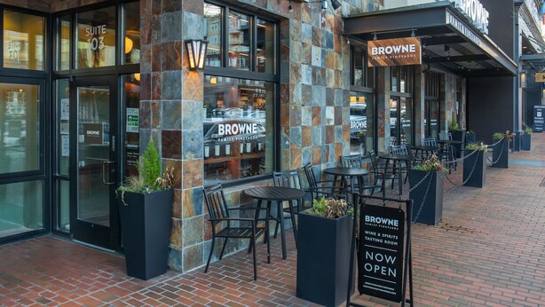 A restaurant with outdoor seating, a sign indicating it is now open, and a view of the interior through the windows. - Kasa Bellevue Seattle (Bellevue)