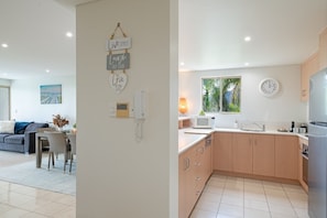 Microwave, oven, dishwasher - Modern 2-Bedroom Airlie Beach Apartment With Pool, Spa & Port of Airlie Views (Airlie Beach)