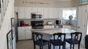 Kitchen with granite counters and huge center island with breakfast bar