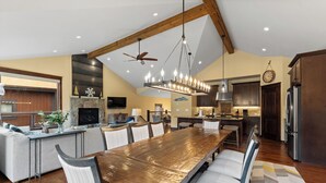 A spacious kitchen with a large island, wooden ceiling beams, and modern appliances. - Luxury Townhome w/ Gorgeous Slope Views and Close to Gondola, Shops & Dining! (Keystone)