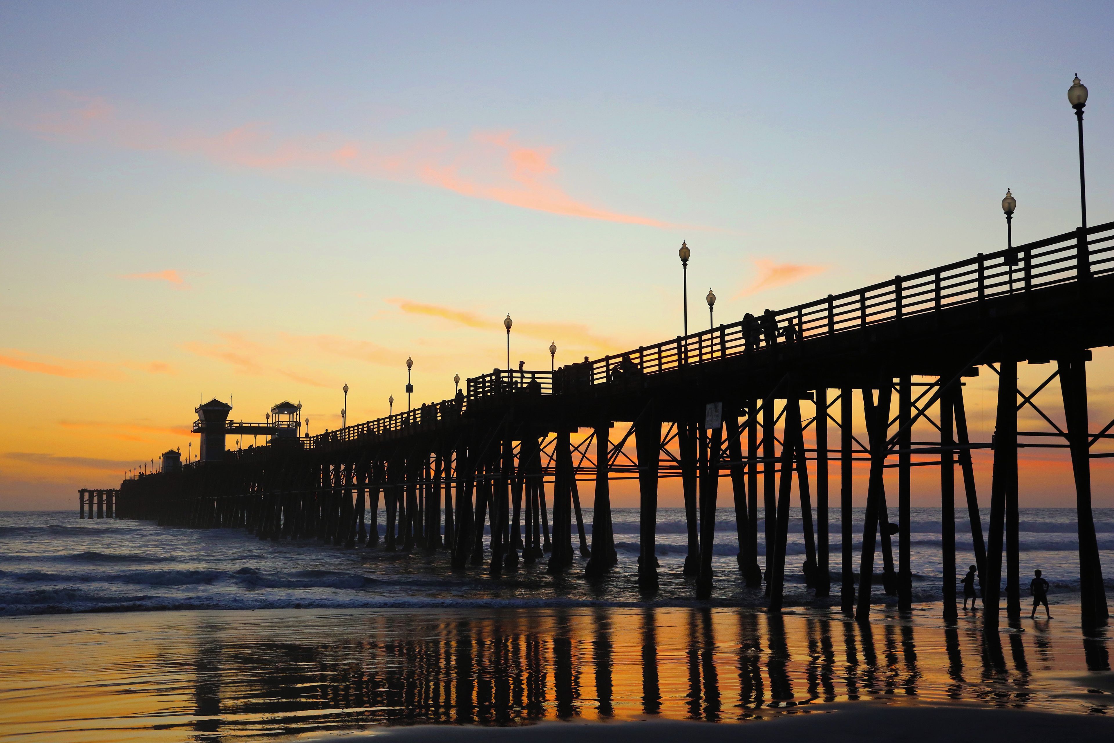 A pier extending into the water with a structure at the end, likely a lookout or control tower.