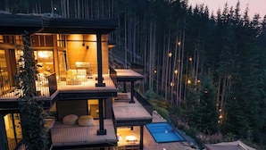A multi-level house with a swimming pool, outdoor seating, and a deck. - Chalet La Forja - Ski in Ski out Kadenwood Estate (Whistler)