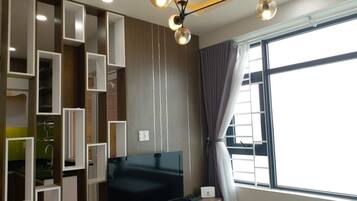 An's Houze Condo | Living room | Flat-screen TV
