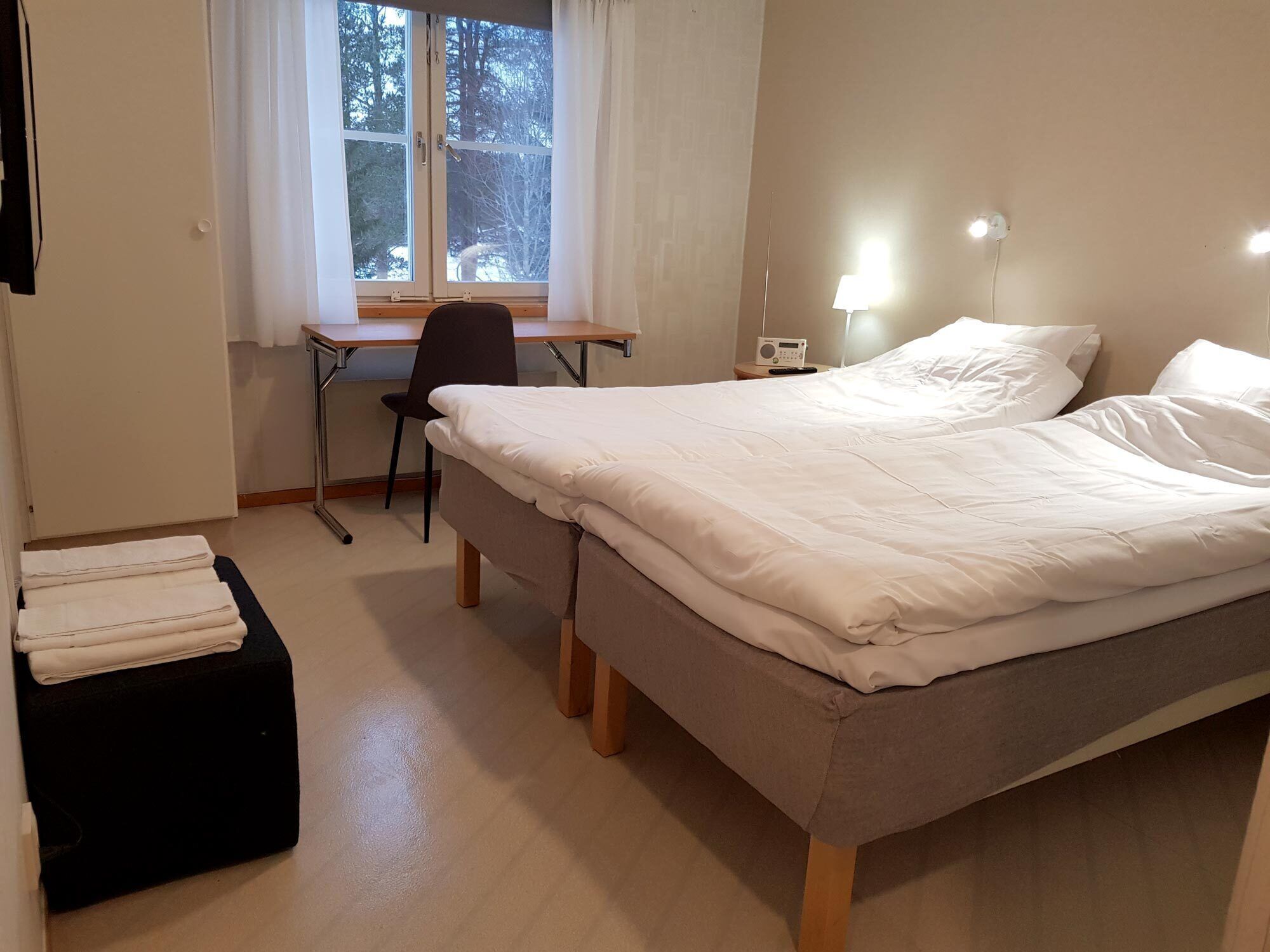 Desk, laptop workspace, free WiFi, bed sheets