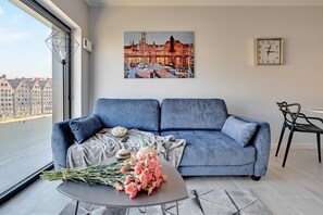 Departamento Deluxe, 1 cama matrimonial y sofá cama, vista al río | Sala de estar en el lobby