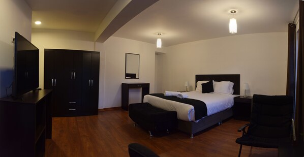 Desk, laptop workspace, blackout drapes, iron/ironing board