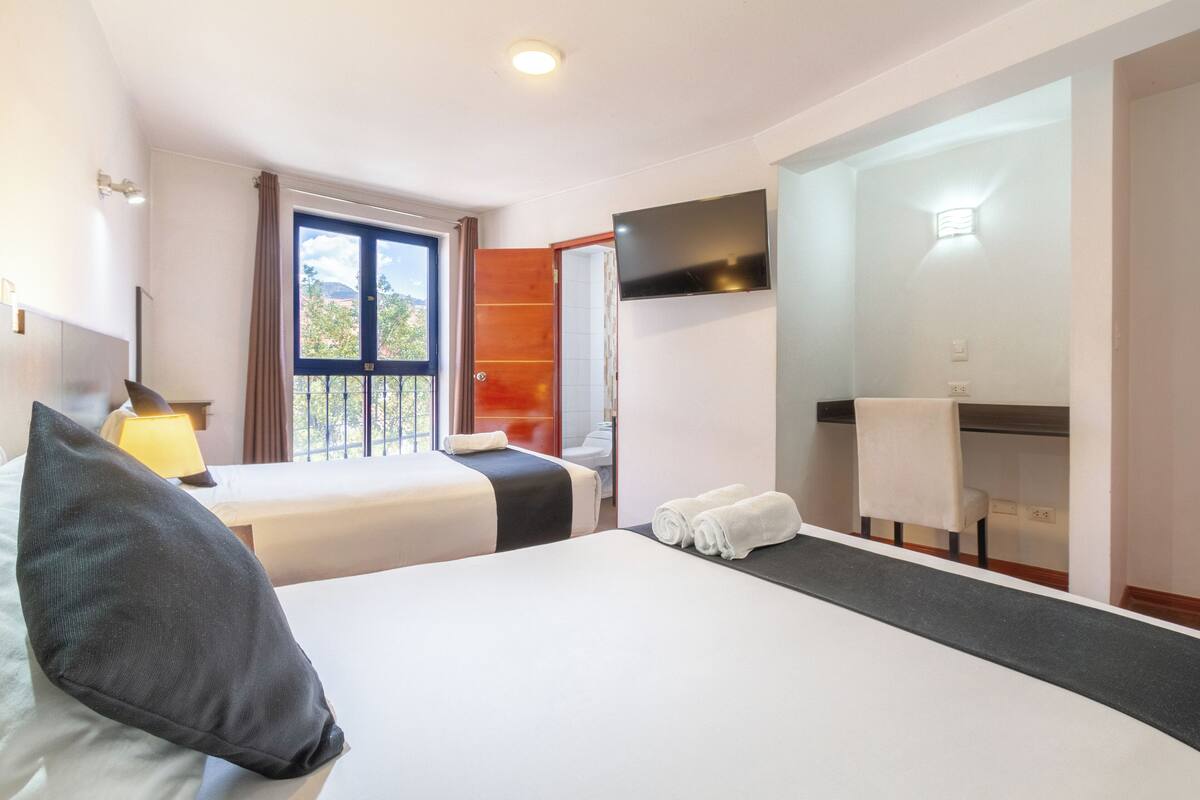 Superior Triple Room | Desk, laptop workspace, blackout drapes, iron/ironing board