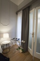 Twin Room | Minibar, in-room safe, desk, blackout drapes