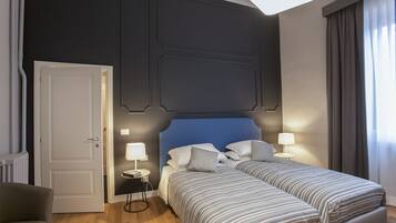 Standard Triple Room | Minibar, in-room safe, desk, blackout drapes