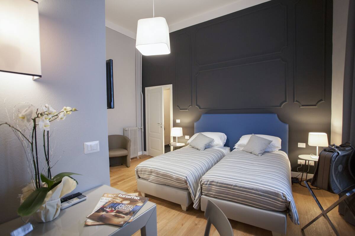 Standard Triple Room | Minibar, in-room safe, desk, blackout drapes