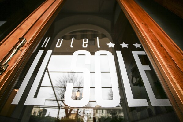 A hotel sign with the name "Hotel 50" and a star symbol.