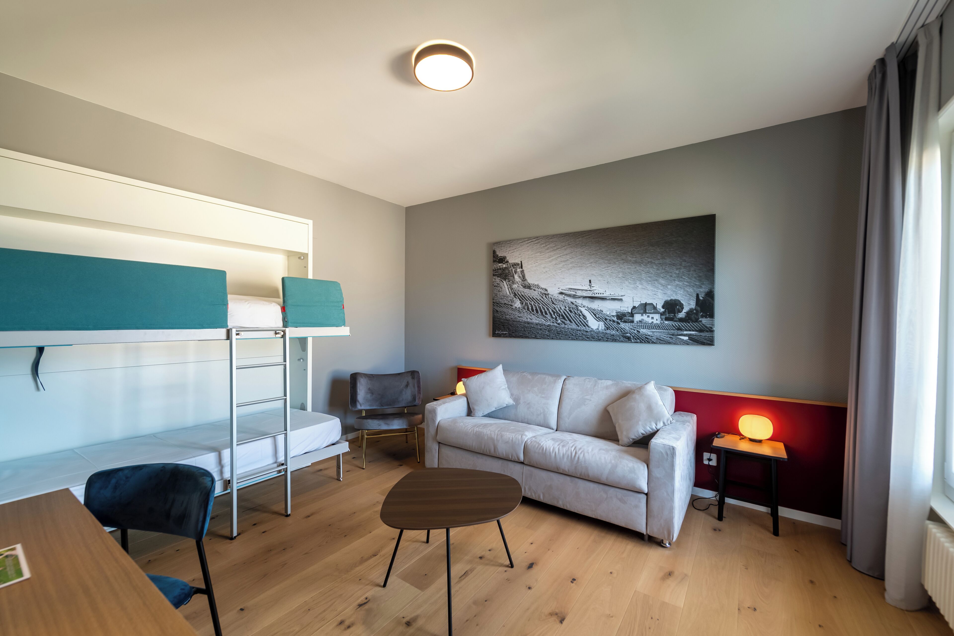 family room, lake view | 1 bedroom, premium bedding, minibar, in-room safe