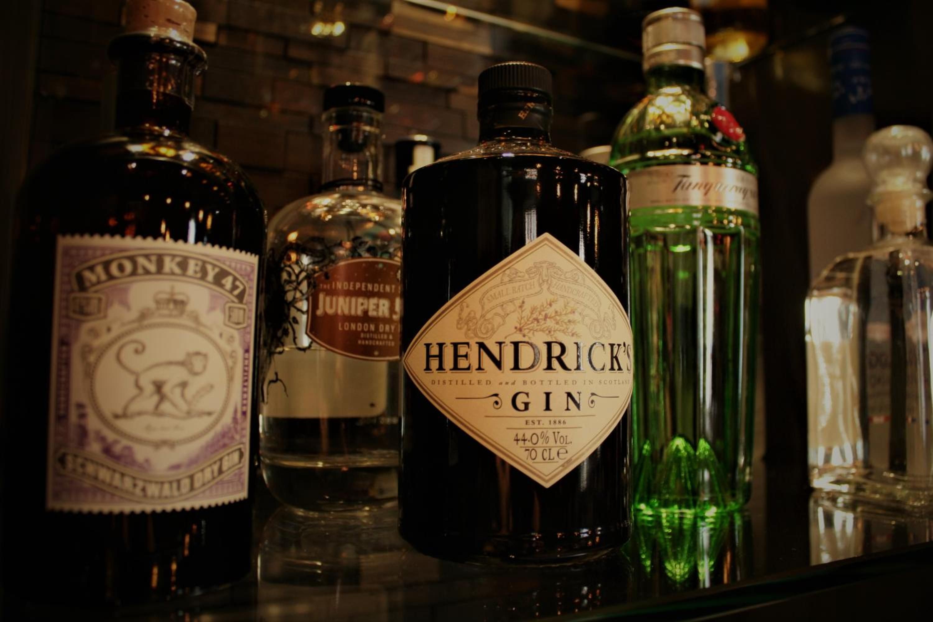 A selection of liquor bottles on a shelf.