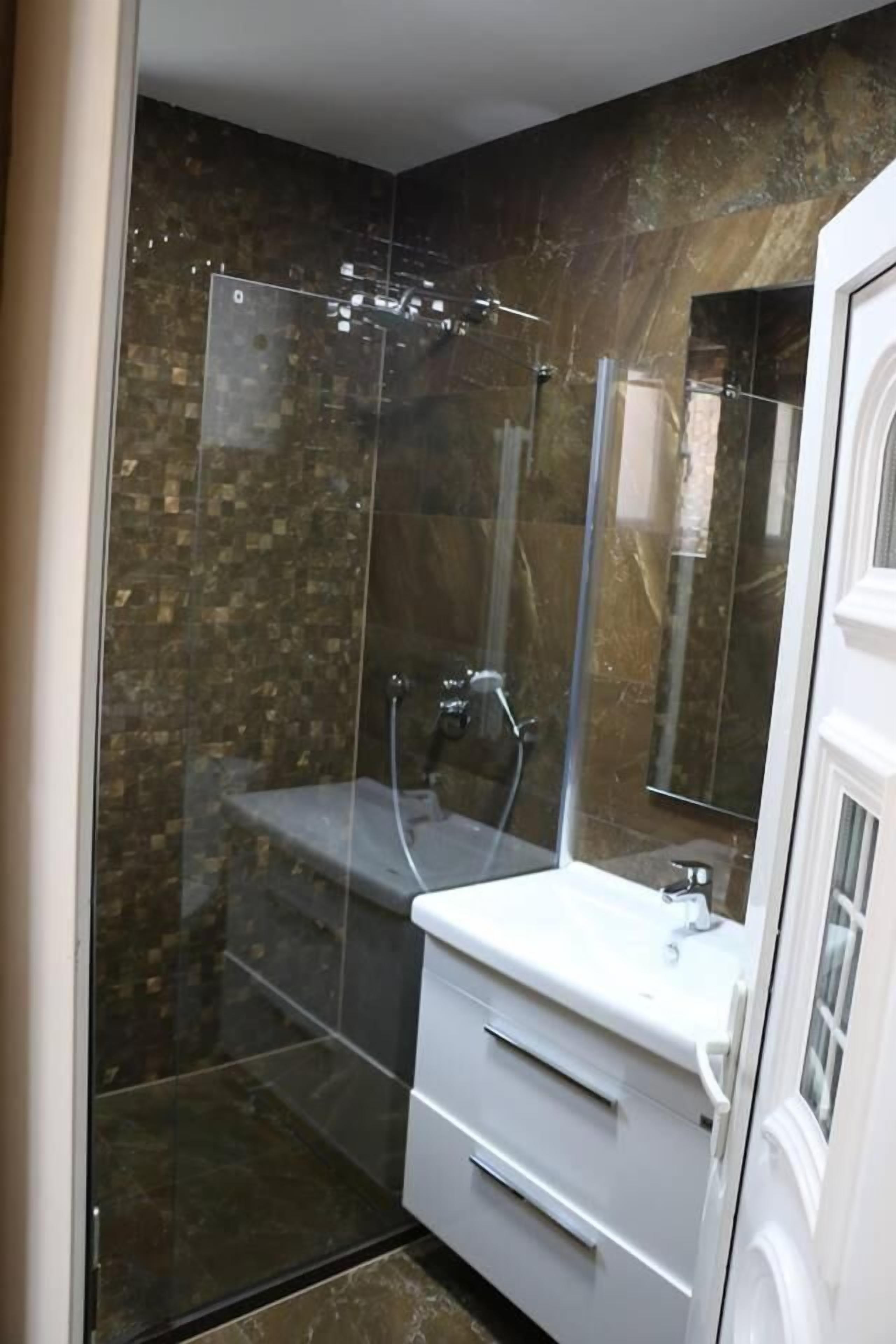 shower, rainfall showerhead, hair dryer, slippers