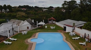 Outdoor pool, pool umbrellas, sun loungers