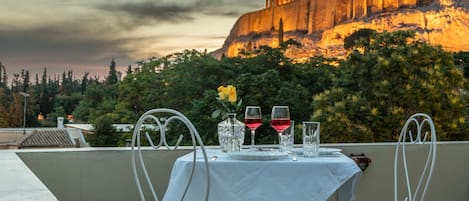 A table set outdoors with a view of a historic building in the background.