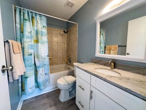 Shower, jetted tub, towels