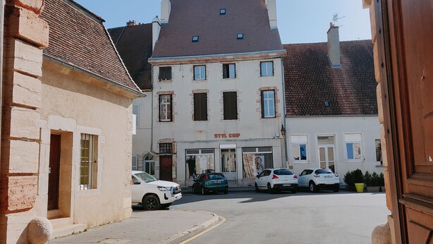 A street view with a building labeled "STVL CONF" and parked cars. - Les Petites Forges Centre Historique Auxonne 120 m2 (5' from A39 freeway) (Auxonne)