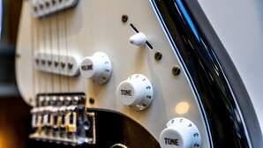 A close-up of an electric guitar's control knobs and switches. - The School House - sleeps 2 guests  in 1 bedroom (York)