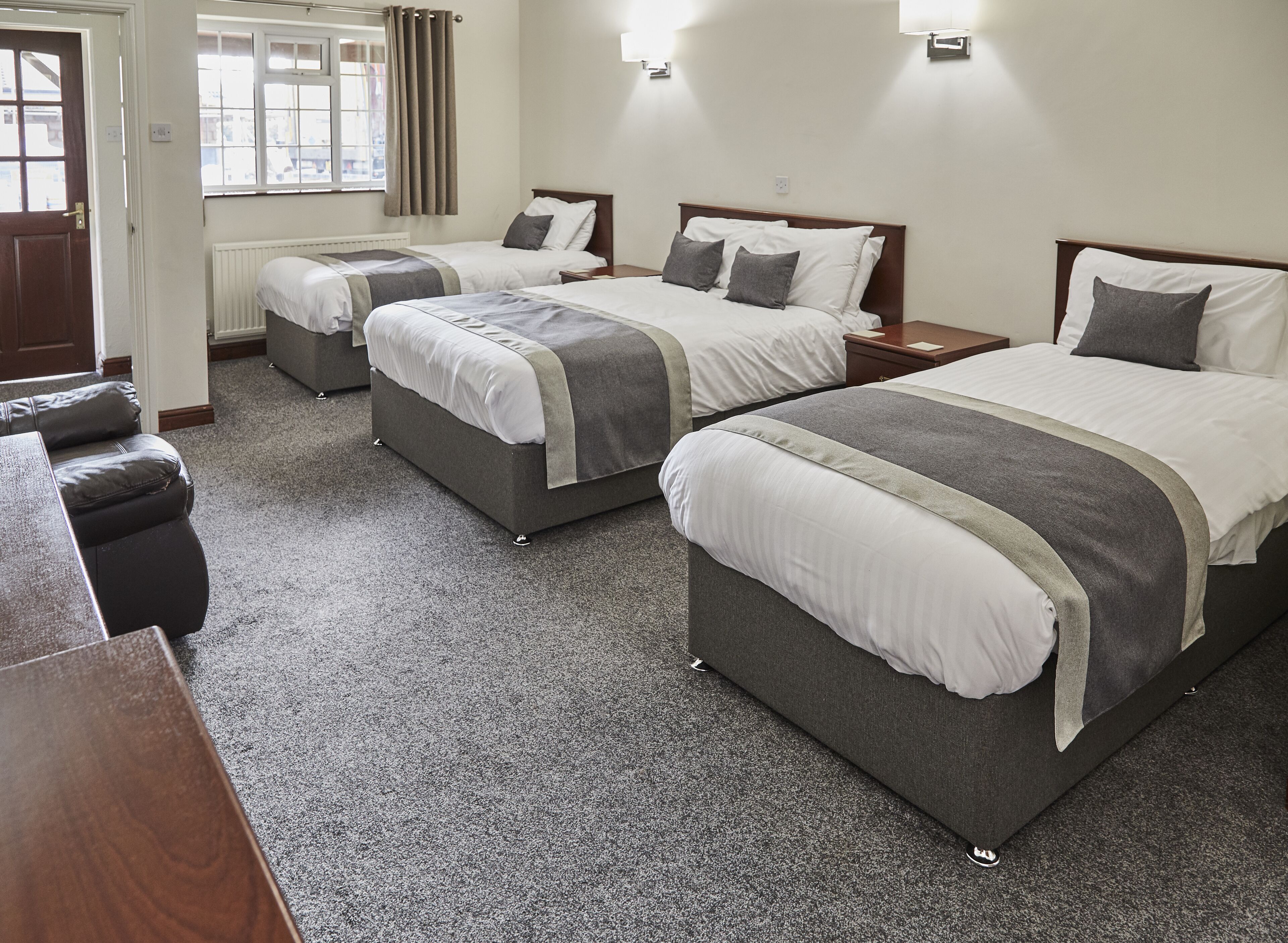 quadruple room, multiple beds | desk, laptop workspace, iron/ironing board, free wifi