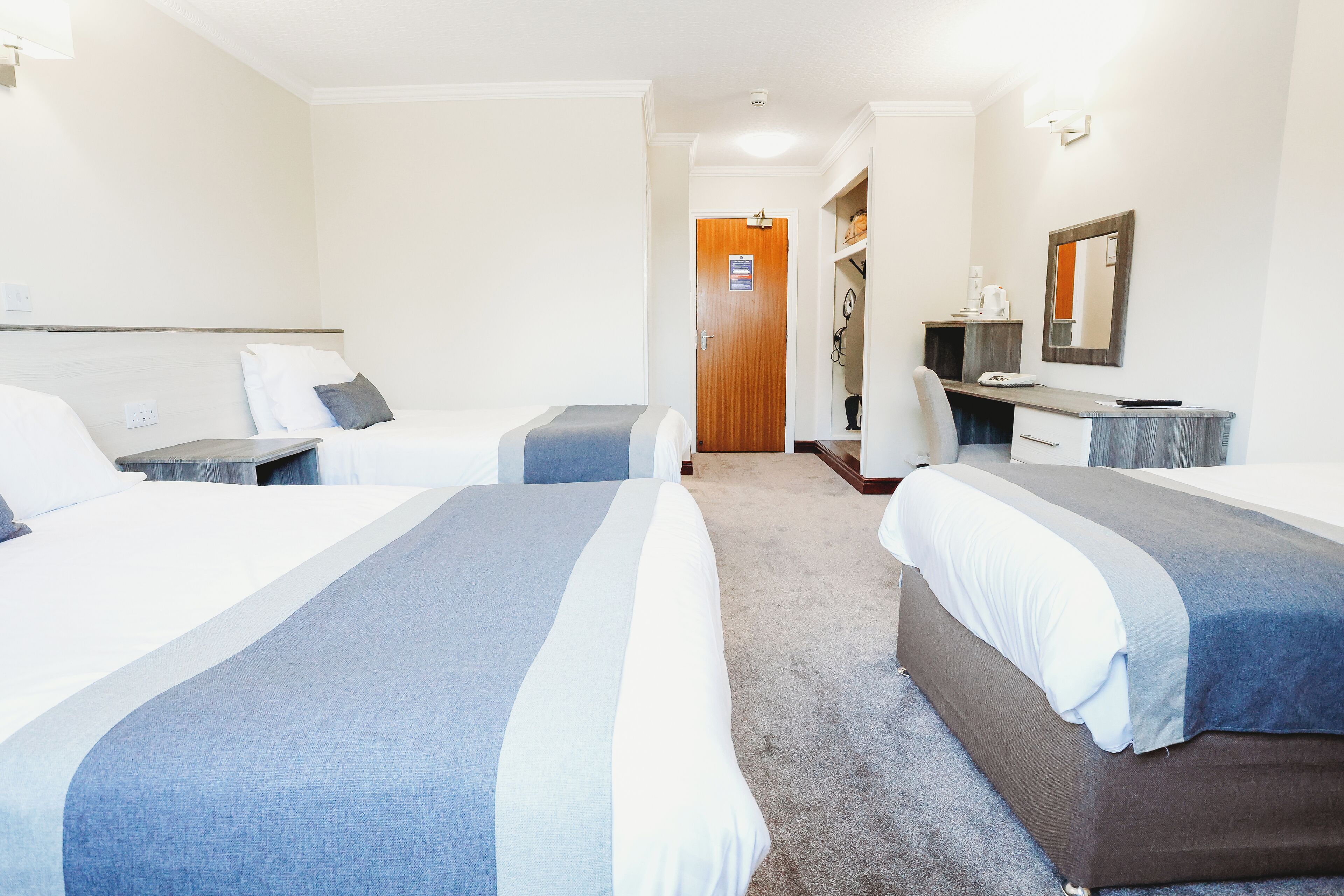 quadruple room, multiple beds | desk, laptop workspace, iron/ironing board, free wifi