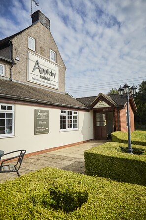 A building with a sign reading "Appleby Restaurant, Bar & Accommodation" and another sign for "Hotel Reception & Adelaide Suite." - Appleby Inn Hotel (Swadlincote)