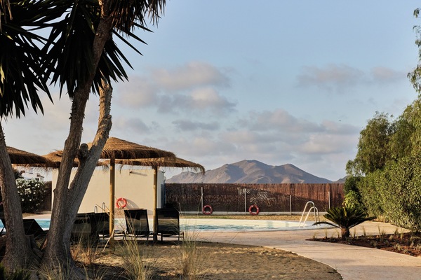 Seasonal outdoor pool, pool umbrellas, pool loungers