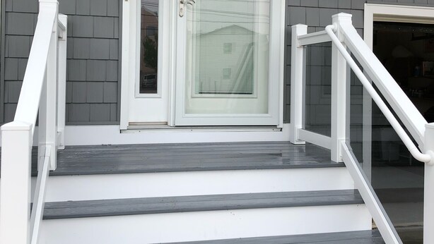 A staircase with white railings leading to a double glass door. - Ocean Views, Watch the breakers from the Deck; B side (Brigantine)