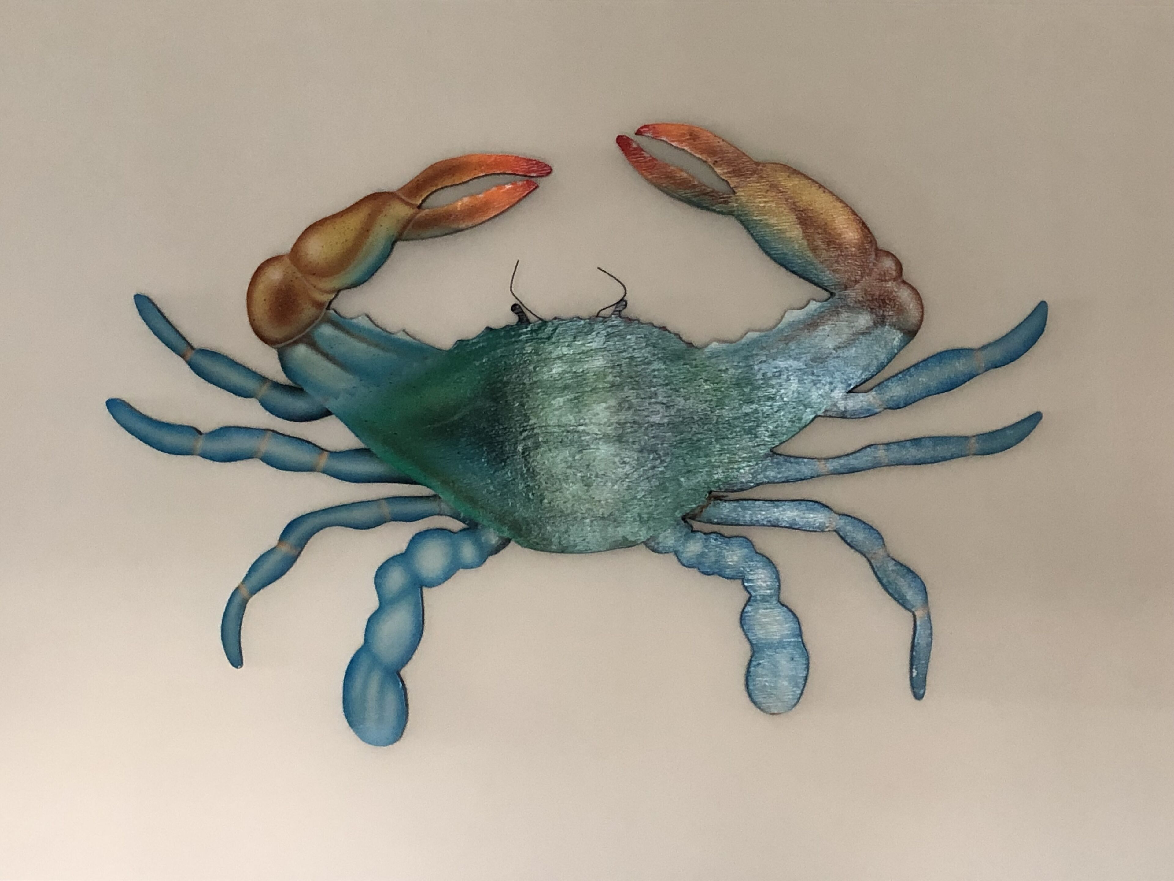 A wall-mounted crab decoration.