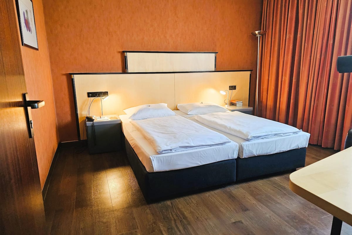 family room | 1 bedroom, minibar, in-room safe, desk