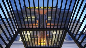A modern building with a glass facade and a metal railing. - Af-Ra Hotel (Konyaalti)