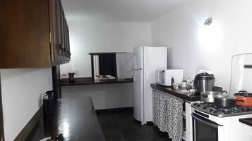 Fridge, microwave, cookware/dishes/utensils