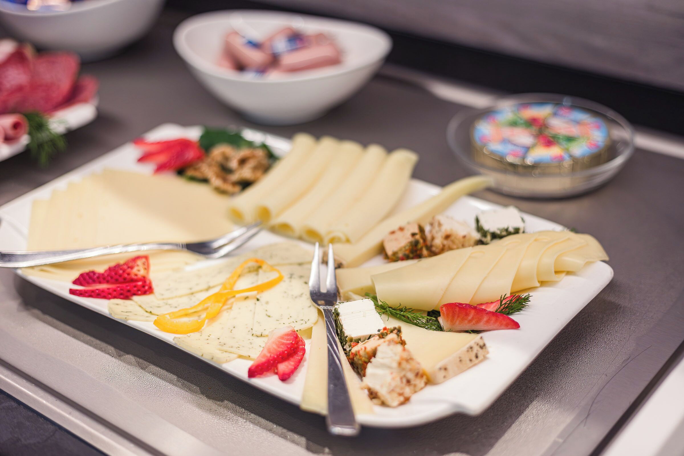 A plated dessert with various toppings and a fork.