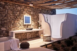 Shower, designer toiletries, hair dryer, bathrobes