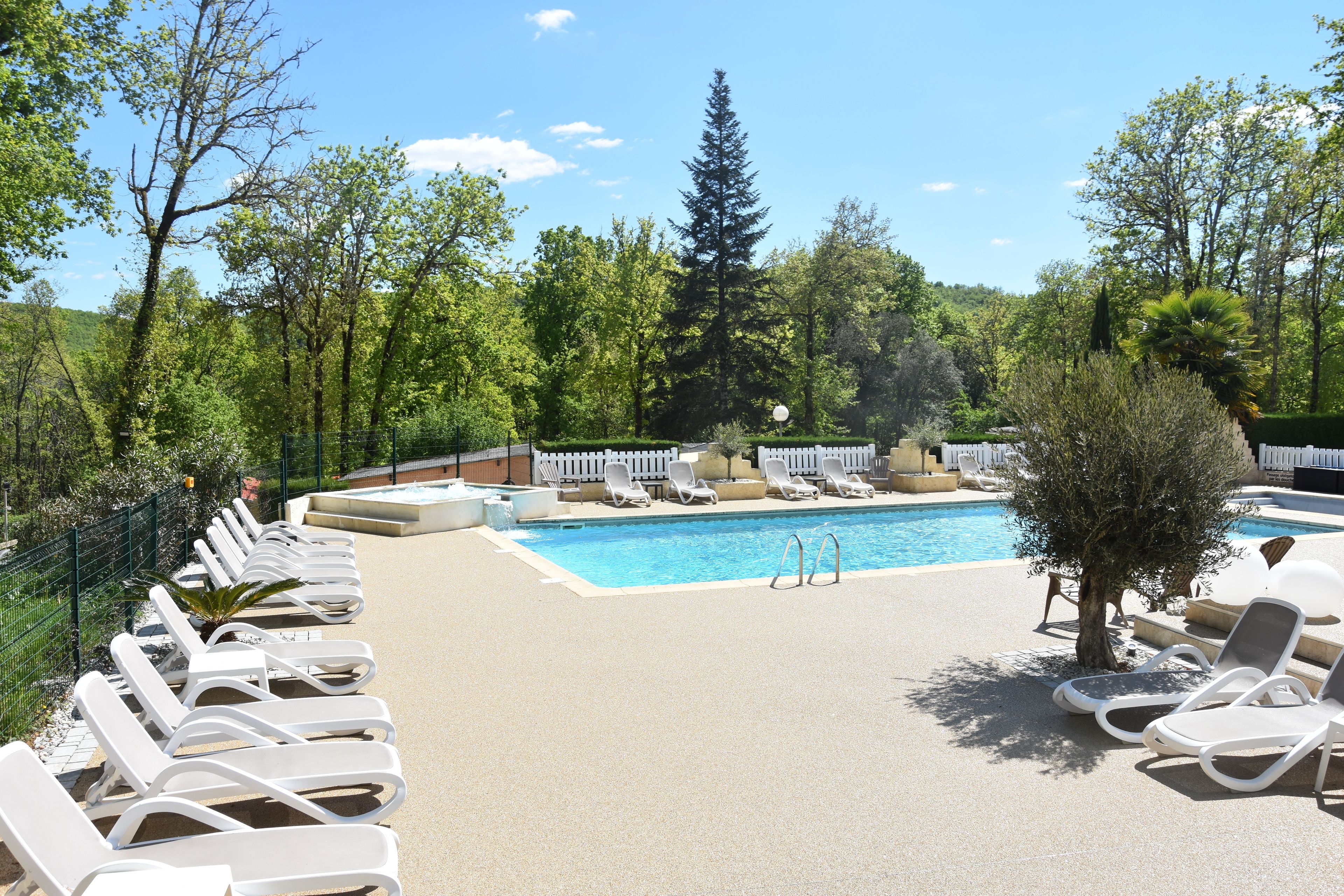 Seasonal outdoor pool, open 10:00 AM to 8:00 PM, pool umbrellas